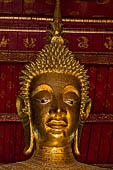 Luang Prabang, Laos - Wat Mai, detail of the Buddha altar inside the sim. 